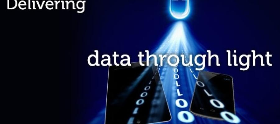 text Delivering data through light over an image of a lightbulb emitting 1s and 0s (binary) to represent data through light lifi